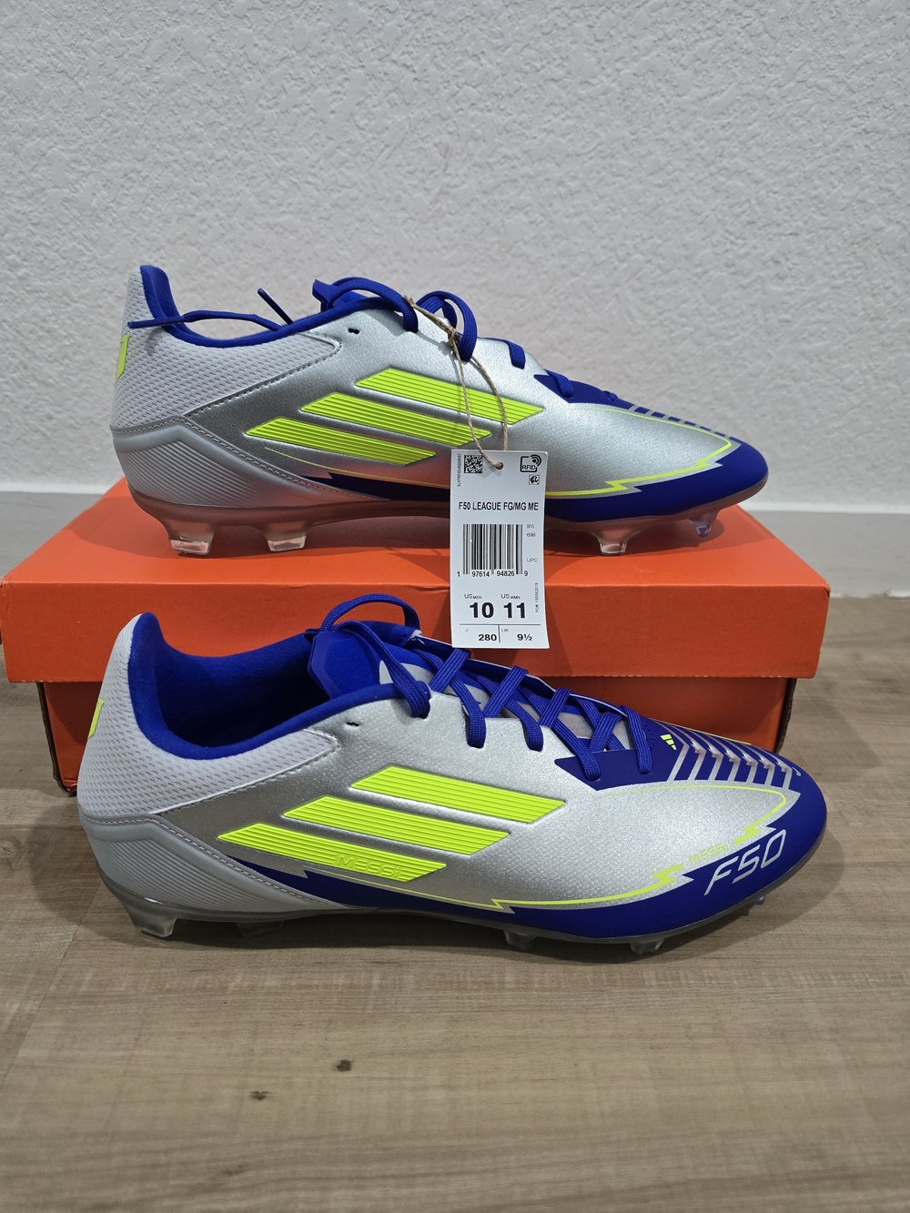 Adidas Silver & Blue Soccer Cleats with Neon Yellow Accents.9M/10W